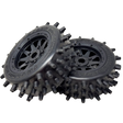 Two black off-road wheels with spiky tread pattern on a white background