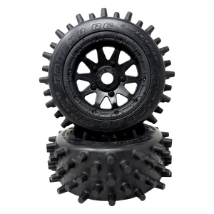 Black RC tire with spiky tread pattern on a white background