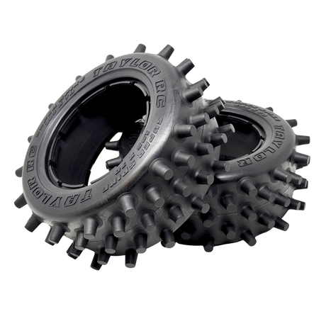 Two black off-road tires with spiky tread pattern on a white background