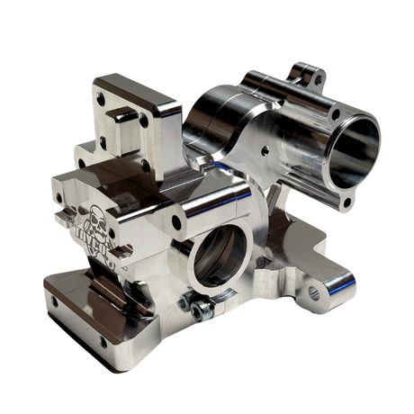 Taylor RC V2 billet 3-piece Vesla transmission housing in raw silver, viewed from a front 45-degree angle