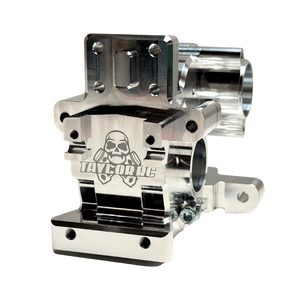 Close angle of the Taylor RC V2 billet Vesla transmission housing highlighting the engraved skull logo, raw silver finish