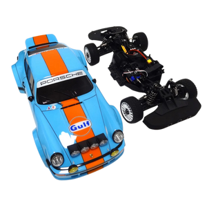 Toy car with Porsche branding and Gulf logo, showing both finished and unassembled parts on a white background.