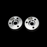 Two metal MCD shock pistons with TZZ logo on a black background