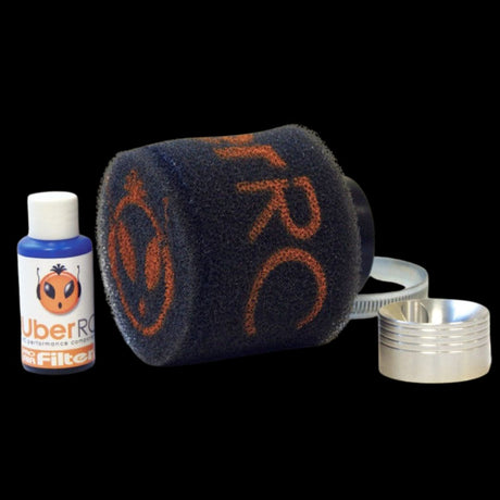 An air filter kit which includes a black filter with orange Uber RC branding, a bottle of Pro Air Filter Oil, and a velocity stack.