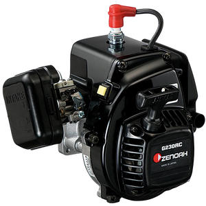 A Zenoah G230RC 2-stroke gasoline engine with a black casing, silver metal components, a red fuel cap, and a black pull-start handle, shown on a solid white background.